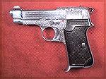 This is a Beretta 1935 that appears to be custom engraved, since it doesn''t match the description for the factory engraved models.