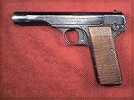 This is a WW2 Nazi marked pistol, manufactured in 1944.  It''s machining is pretty rough, as are the grips.  This is common for pistols manufactured late in the war.