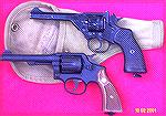 These are the two main handguns used by the British forces in WWII.  The Victory was made by Smith and Wesson by adapting their Military & Police.  This one has New Zealand markings.  The Webley is a 