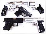 Comparison of 5 pocket guns. The smallest Glock, the Kahr K9, the Ruger SP101, the S&W J Frame, and the diminutive Kel Tec P32