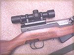 Norinco SKS with Norinco scope and mounting system, which comprises a replacement bolt cover and rings.