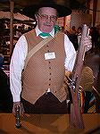 Jim Wolford holding his new blunderbuss, at 2002 Enumclaw BP show. Clothing also hand made by Jim.