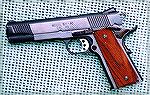 Springfield 1911.  This is what they call the "loaded" model. Springfield 1911Herb Schlossberg