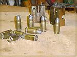8mm nambu and bullet mold . loaded with 3.6gr of bullseye.. cases made from 40 s&w. loaded with a 102 gr bullet
