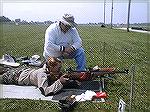My shooting buddy Sam shows the cute nurse Lt. how to shoot his 308 bolt gun.