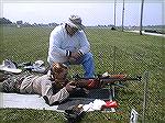 My shooting buddy Sam shows the cute nurse Lt. how to shoot his 308 bolt gun.