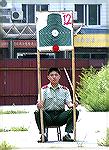 An enthusiastic Norinco junior employee assisting on the state-of-the-art People's Firing Range and Testing Facility.