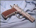 EAA Witness 10mm auto with "Wonder Finish" and Tanfoglio walnut stock panels.