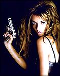 Actress Liz Hurley with what looks like a little Beretta .380, or possibly a Browning, which is made by Beretta...