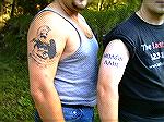 A couple of Canadian Firearms enthusiasts sporting "Molon Labe" tattoos. This refers to the "Molon Labe" reply given by Spartan King Leonidas and his 300 Spartans to the massive Persian army at Thermo