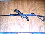 British 9mm Sterling semi-auto carbine with stock extended and 34 round magazine.