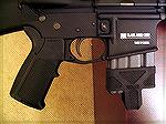 This is the Magpul MIAD grip, that is adjustable for hand size by swapping out various thicknesses of front and back straps. Included in the kit is a funky trigger guard.