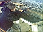 A Boy Scout has a chance to shoot a bolt-action .22 during a familiarization firing event.  The Scouts also had an opportunity to shoot shotguns at this event.