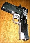 My Kimber Custom Compact after refinishing in hard chrome and installing MMC fized sights with a Glock-type sight picture.  The rubber panels are OEM Kimber.
