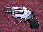 This Model 60 Chief's Special in .38 Special dates from prior to 1971 at least.  (The previous owner bought it then.)  It has had the hammer bobbed to prevent snagging, the chambers chamfered for fast
