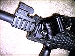 I installed a QD sling swivel mount to the left front side of my AR, to accomodate the attachment of either a 2-Point or 3-Point sling. Again, the sling is easily removed by pressing on the button in 