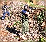 This was our first Tac Rifle match, when we had not yet worked out the details. That's me in the background after a 50 yard 'run down' engaging targets 50 yards away on the 100yd range. I thought at t