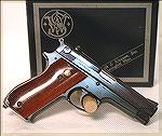 A Smith & Wesson Model 39 with a steel frame.  These versions are fairly rare as the majority had an aluminum frame.  The smooth stock panels shown are unusual as well.