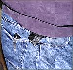 This is why I prefer IWB (Inside the Waist Band) holsters to externally mounted ones.  It shows my Springfield XD40 (in the plastic belt slide holster that comes with the XD40 package) as carried unde