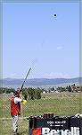 Tom Knapp shooting extended barrel with sub sonic load. You can see muzzle smoke and shot string headed toward target.