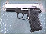 A well worn and modified S&W 3913 9mm pistol.