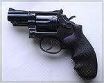 A well used S&W Model 19-3 with 2 1/2" barrel. This gun has a round butt and came with after-market wood grips. It is currently fitted with the Hogue grips shown.