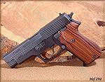 SIG P220 .45 with smooth Pau Ferro wood grips from Hogue.