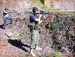 Taken in 2005 at one of our first (if not THE first) Tac Rifle matches on Thompson Mountain. That's me in the background staunchly defending our position against charging hordes of IPSC targets alongs