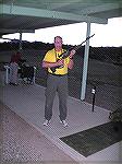 Me standing on the highpower rifle silhouette range at the NRA Whittington Center.  I'm holding an FNH SPR chambered in .308 Win.  The rifle is equipped with Leupold Mark 4 3.5-10x40mm LR/T.  I've jus