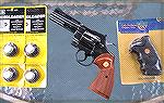 An old Colt Python with old accessories. All are as new, and unused!