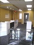 This is the finished showroom of NOVA Armament. This view is from the front of the store. The bathroom that caused all the trouble was moved from where the counters and displays are to the far right h