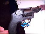 This is the newest S&W revolver, chambered in .38 SPL consisting of an aluminum frame with a steel cylinder tied into an integrated laser, and an ambidextrous cylinder release built into where the ham