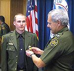 Inactive forum member Chuck Hubbert's oldest son Andy, shown graduating from the US Border Patrol Academy.  Andy is stationed in Texas.  I've known Andy since he was a skinny little pre-teen with glas