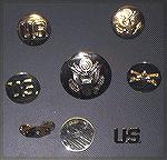 In answer to a forum question about two-piece brass, this is a picture of some of my old brass (about 50 years old).  The top row are as-issued lapel insignias, stamped from thin sheet brass.  The mid