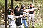 Dan Coonan watches his daughters shoot the newest version of his namesake pistol, the Coonan Classic .357 Magnum.