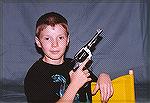 My son, many years back, holding a ruined old M1917 S&W that some fool took a Dremel to in order to remove the finish.  Well that worked!   I ended up taking it apart to use as a parts gun for a later