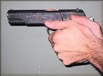 This is the modern handgun grip where the hands and fingers grip the gun and the thhumbs are just along for the ride.
Photo by Ron Avery