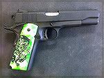 Rock Island Tactical 1911 chambered in 9MM with Hogue 1911 Zombie Grips. 