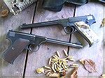 Couple of wonderful old Colt Woodsman pistols, photo by Xavier.  Top pistol 1940 bottom 1942. 