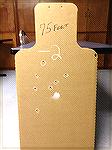 Full size humanoid cardboard target shot with a Remington Police 870 shotgun (18.5" IC barrel), using Federal 00 Buck at a distance of 75 feet.