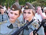 Former Eastern bloc soldiers, no doubt, as they are armed with AK-74 rifles, obvious by the 90 degree gas block, but I don't recognize the uniform.  Anyone have any idea in which army these young ladi