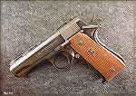 Scanned photo of my 1960s-era Llama Especial .380ACP, an almost perfect clone of the 1911, save the slide rib, not found on all models, and the screwed-on plunger tub, versus most 1911 pistol's staked
