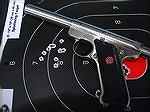 Ruger Mark III Target Model with CCI Mini Mags at 20 yards bench rest aiming at the number 8