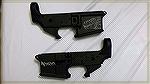 When I go custom, I go custom. These are 2 AR-15 lowers that came from ShadowOps Weaponry. Both have the NOVA Armament logo as well as the ubitquitous Tyrannosaurus Rex head. They were offereing free 