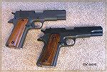 Rock Island GI Mid-size (Commander) .45ACP, top, Rock Island GI Full-size (Government) 9mm, bottom.  Both 100% reliable, fun to shoot pistols.  In real life both pistols are the same Parkerized gray, 