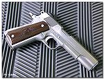 One of my favorite M1911s, one I've shot more than any M1911 except for my oldest Colt, is this 20+ year old Springfield Armory M1911A1 in stainless steel.  Very plain, built in the "pre-loaded" days 