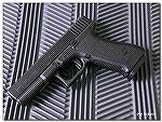 My Gen 2 Glock 22.  A police trade-in, I have refinished the slide in Brownell's Alumu-Hyde II, and replaced the sights with all-black target sights that allow huge amounts of daylight on both sides o
