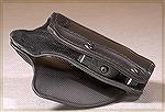 The Safariland Models 567 (belt) and 568 (paddle) holsters use two Chicago screws and an adjustable plastic block to make the holster fit most mid-sized semi-auto pistols.