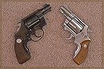 A Colt Detective Special and a Smith & Wesson Chief's Special, both with Tyler T-Grip grip extensions.