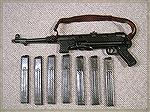 MP40 Sub-machine gun. An open bolt 9mm luger that offered a slow rate of fire to allow you to select fire by simple pressing the trigger and not have to press any other switches or buttons. The low co